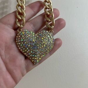 Natasha gold heart necklace NWT measures 18 inches.